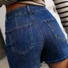 Bluing Asymmetric Wrapped Buttoned High Waist Denim Shorts