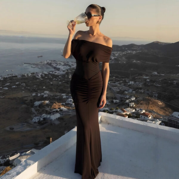 Model wearing sleeveless pleated party dress